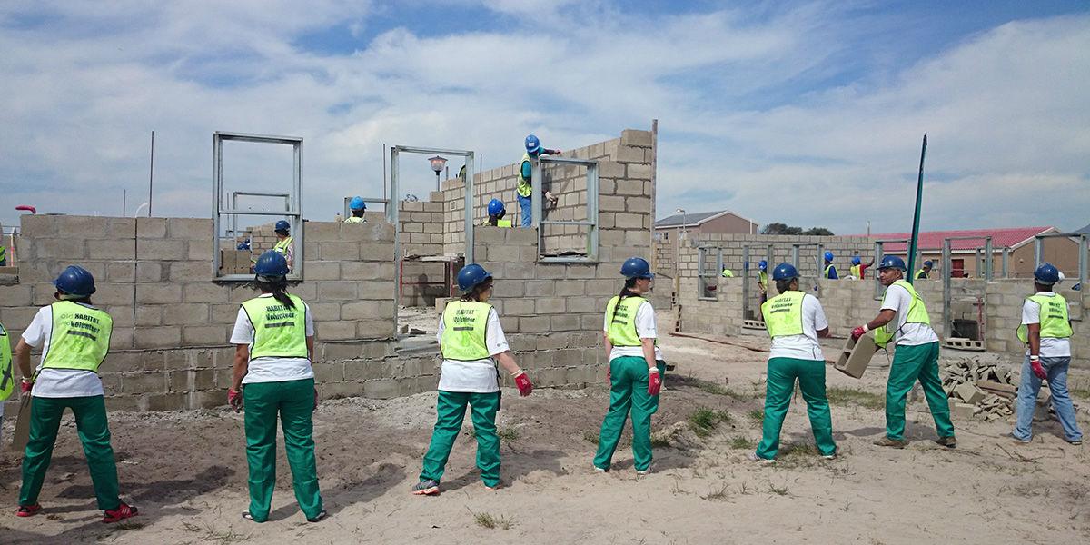 Construction team working on block wall structures