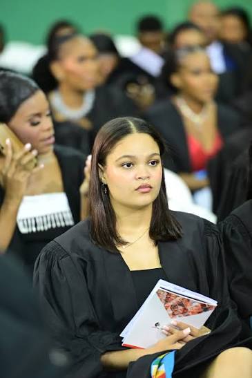 Graduate holding programme booklet