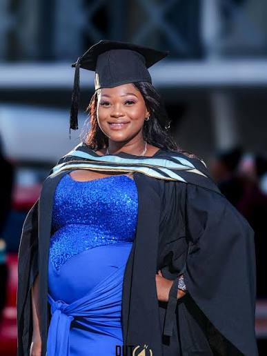 Graduate portrait in blue dress
