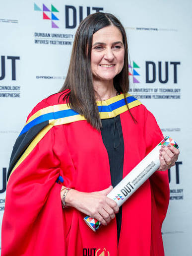 DUT academic portrait in red gown