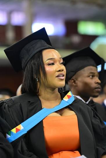 Graduate seated during ceremony