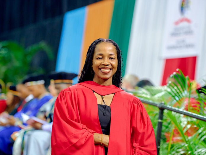Graduate portrait in red academic gown