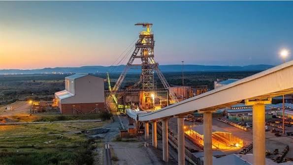 Mine headgear and conveyor infrastructure at dusk